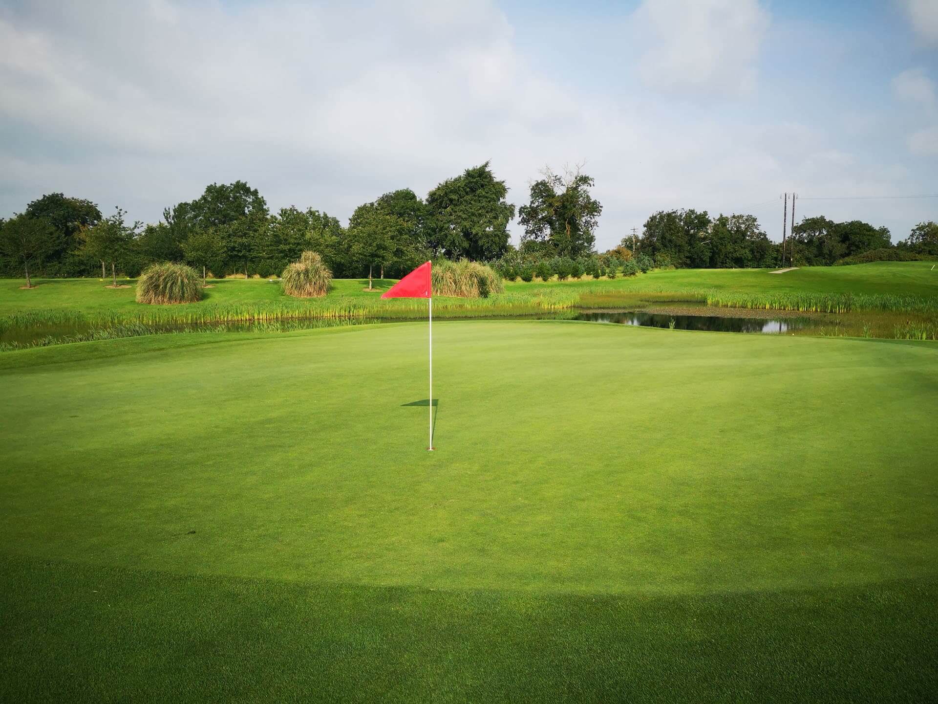 View of 9th golf hole with flag